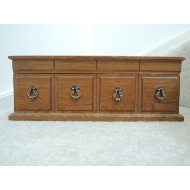 Jewelry music box that plays "Shadow of Your Smile". Cane top oak wood vintage 1970s Japan. This vintage 1970s musical,...