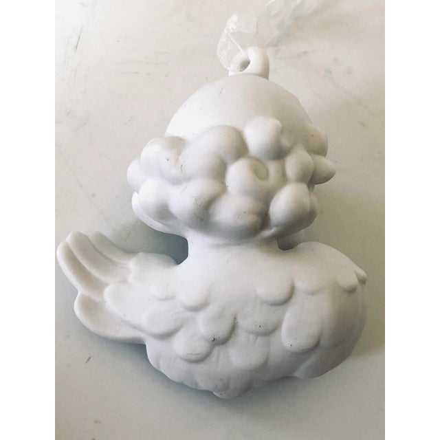 A little angel bust ornament in white bisque perfect for your tree, wreath, table ornament or anywhere you choose.
