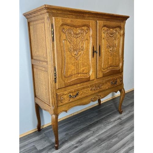 A beautiful Vintage French Louis style oak cabinet, crafted with elegance and traditional charm. This stunning piece...