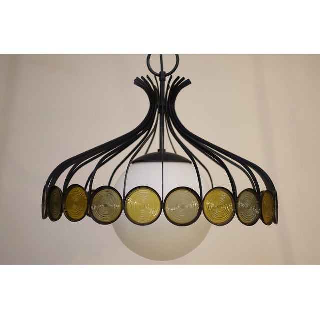A dramatic and sculptural "Parasol" shaped Atomic wire cage frame form hanging pendant swag style lamp designed and...