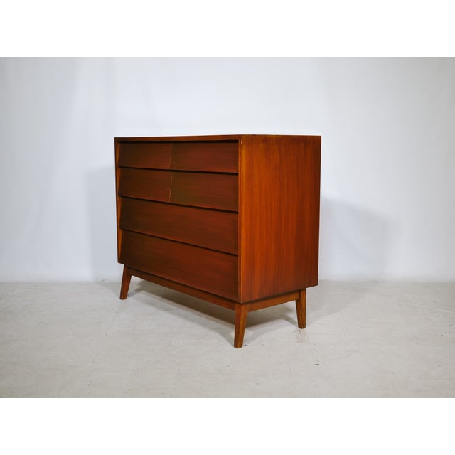 Vintage teak chest of drawers, 1960s. Six drawers in varying sizes offer practical storage space, while the warm teak...