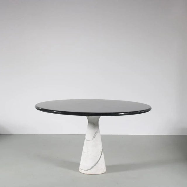 A fantastic dining table designed by angelo mangiarotti, manufactured by skipper in italy around 1960. this impressive...