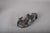 Rolling Dachshund sculpture by Doris Lindner, depicting a dog lying on its back with paws raised. Cast resin with a...