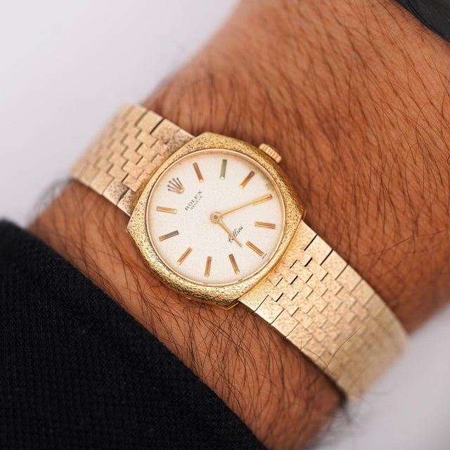 Vintage 1970 Rolex Cellini manual-wind dress watch in an 18K yellow gold cushion-shaped case with a silver-tone textured...