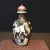 This is a charming vintage Chinese snuff bottle, crafted from Liuli (traditional Chinese glass). The bottle features a...