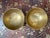 A pair of small bronzed Tibetan singing bowls with lovely engravings on the side. Each has a distinct pitch, with a warm...