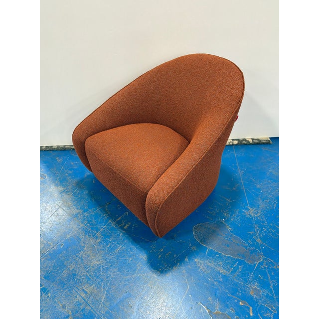 Stylish Modern Slope Swivel Chair with Clay nubby fabric. Showroom floor sample.