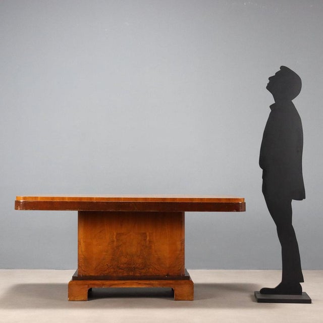 Vintage Italian-made table with rectangular top in walnut and walnut burl. This piece is attributed to the mentioned...