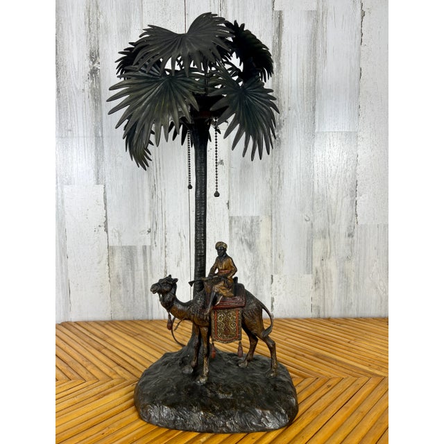 Viennese cold painted bronze orientalist lamp attributed to Bergman of a middle eastern man riding a camel. Signed Austria.