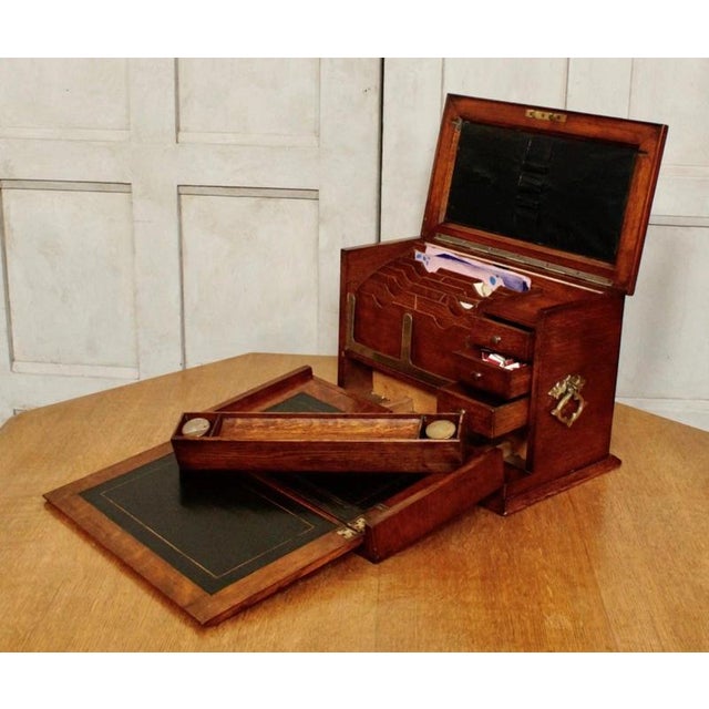 A superb Victorian fitted stationery box dating to circa 1890, finely constructed from oak and retaining an unusually...