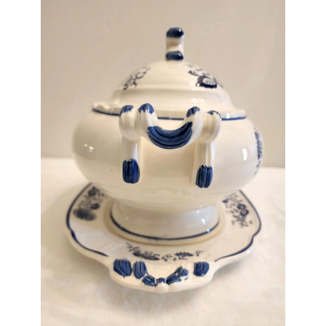 A blue onion style, nature inspired soup tureen in a delicate floral motif. A classic blue and white pattern to add to...