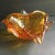 Amber mid century Venetian / Murano glass bowl with bullicante controlled bubble design and gold foil inclusions. The...