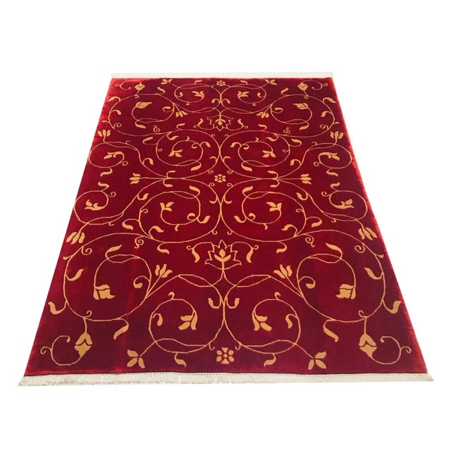 This hand-knotted rug is unused.