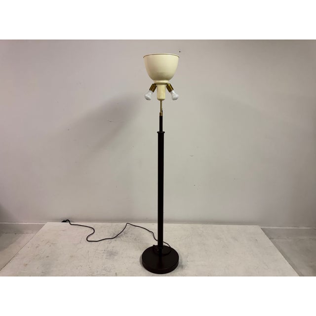 Elegant 1960's floor lamp by Charlotte Wawer in dark brown leather. Large parchment leather shade. The hand made drum...