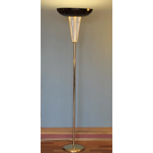 This high standing lamp was produced in Germany in the 1940s. It consists of polished brass (base and tube), six thick...