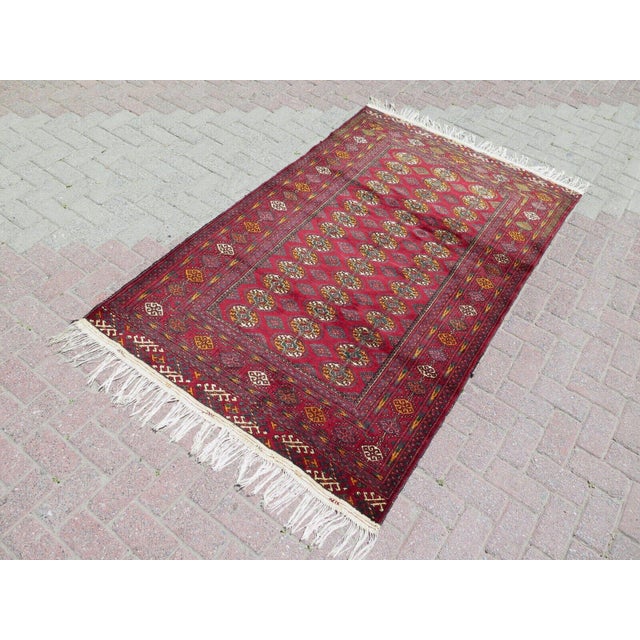 This beautiful, traditional vintage, hand knotted Turkish area rug is approximately 60 years old. It is handmade of very...