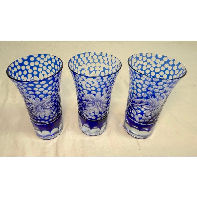 Up for sale is a set of three vintage elaborately cut to clear crystal shot glasses in a beautiful cobalt blue color. Made...