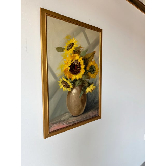 This exquisite vintage oil painting by A. Vincenzi beautifully captures the vibrancy and warmth of sunflowers in full...