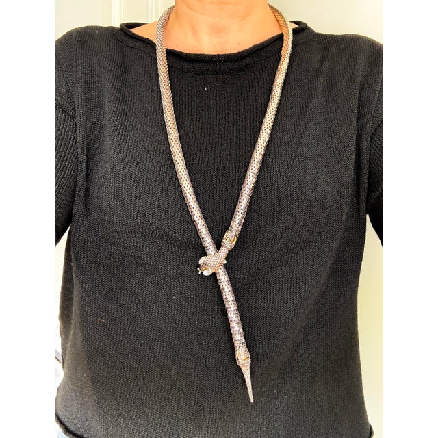 This xl silver-toned snake mesh necklace is a sculptural statement piece in a bold vintage style, attributed to dl auld...