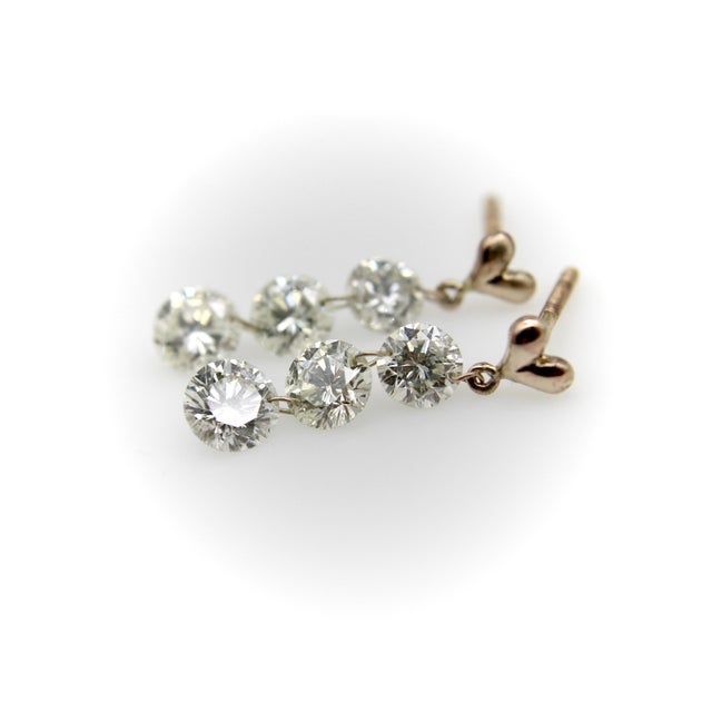There’s something both mesmerizing and magical about the floating diamond phenomenon. These 14k gold earrings each hold...