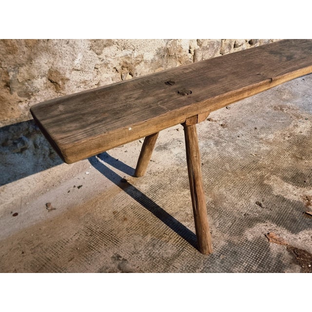 This authentic antique oak bench originates from the Allier region in central France and dates back to around 1900....