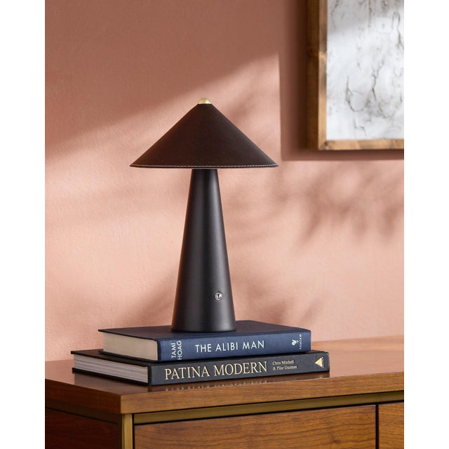 Illuminate your space with a touch of retro flair with the Nomelle accent table lamp. Standing at a charming 12 inches...
