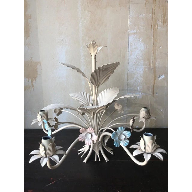 Vintage Italian tole chandelier with 5 arms for lights, pink and blue flowers and white leaves. Tole light fixtures are...
