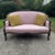 Feminine and cozy -- this vintage loveseat is ready to add inviting color to your home. We love the pretty blush tones of...