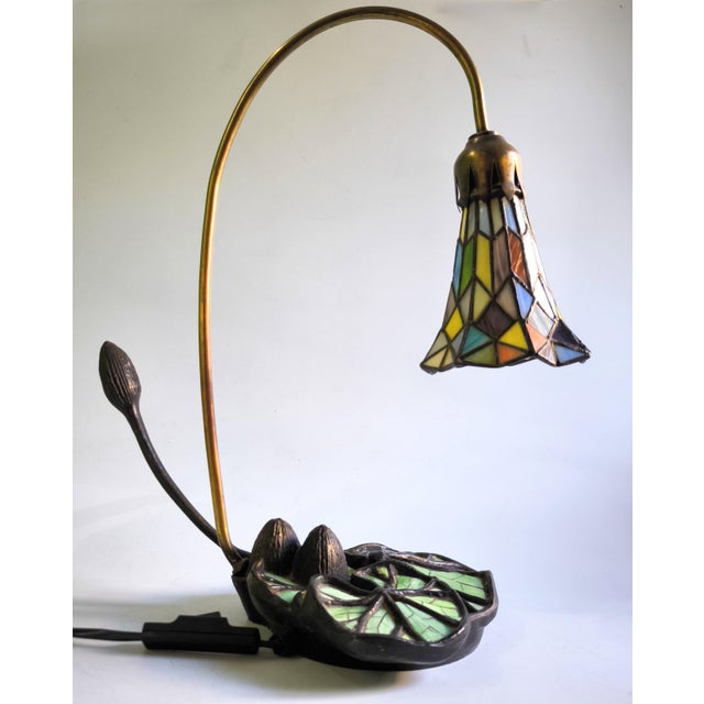 Exceptional Art Nouveau “Lotus Flower” table lamp, from a private collection, dating from the 1970s–1980s. The lamp begins...