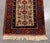 Persian Kazak Wool Runner, with animal and floral design on red ground. 11' 6" x 2' 8" W. Provenance: From a Central Park...