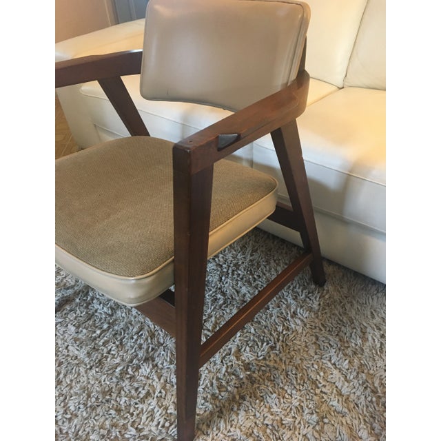 Gunlocke chair with tan upholstery with walnut frame sturdy well made chair