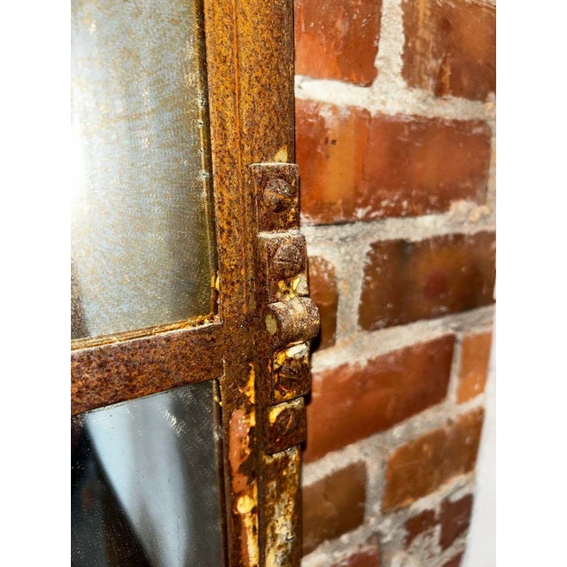 Make a bold statement with this impressive arched window-style mirror, a perfect fusion of rustic charm and industrial...