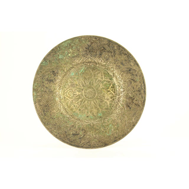 An impressive hand tooled plate Made of low grade silver, all hand chiseled with masterfully executed floral patterns and...