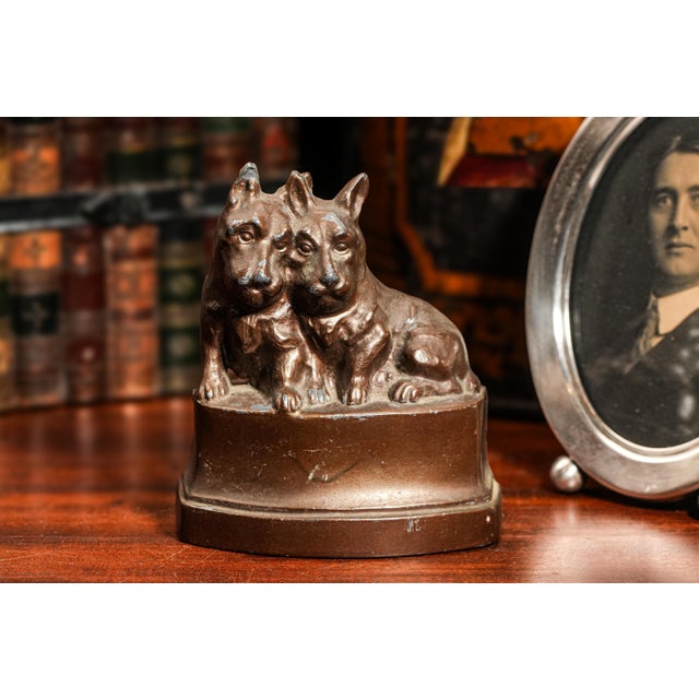 Bring a touch of vintage charm to your decor with this beautifully detailed miniature statue of a pair of Scottish Terrier...