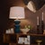 The Hewitt Ceramic Table Lamp balances bold, electrifying color with refined retro-inspired design. Three stacked spheres...