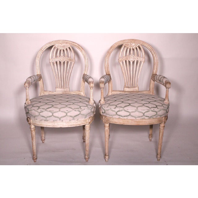 Pair of Drectoire style painted armchairs, late 20th century. With a balloon back, back splat, baluster shaped arm...