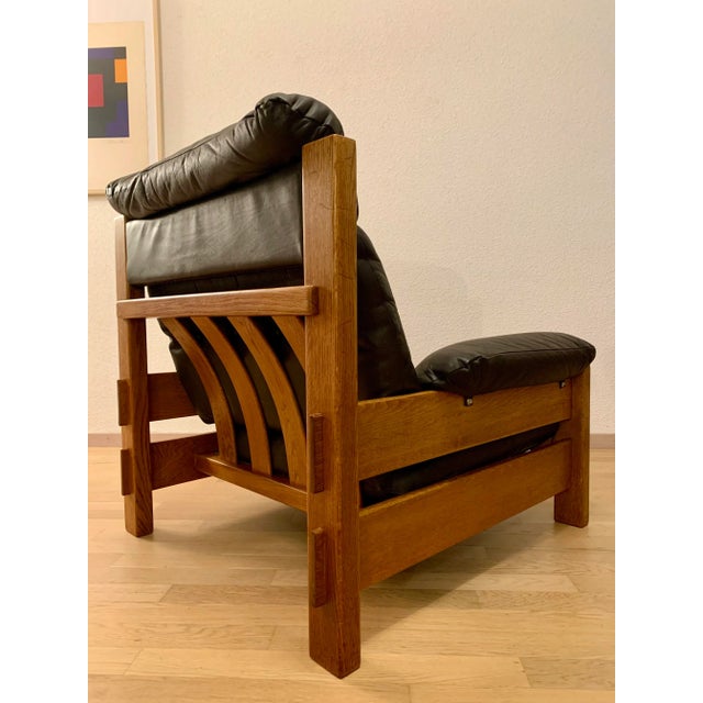 Original from the period. Oak wood. The leather is soft and the foam is still in very good condition. A few scratches.