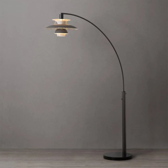 The Palm Springs 1 Light Arc Floor Lamp is a quintessential mid-century classic. The striking shade features multiple...