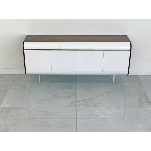 This credenza is a rarity among Vladimir Kagan pieces -- and it is an absolute knockout. Featuring a rosewood top and...