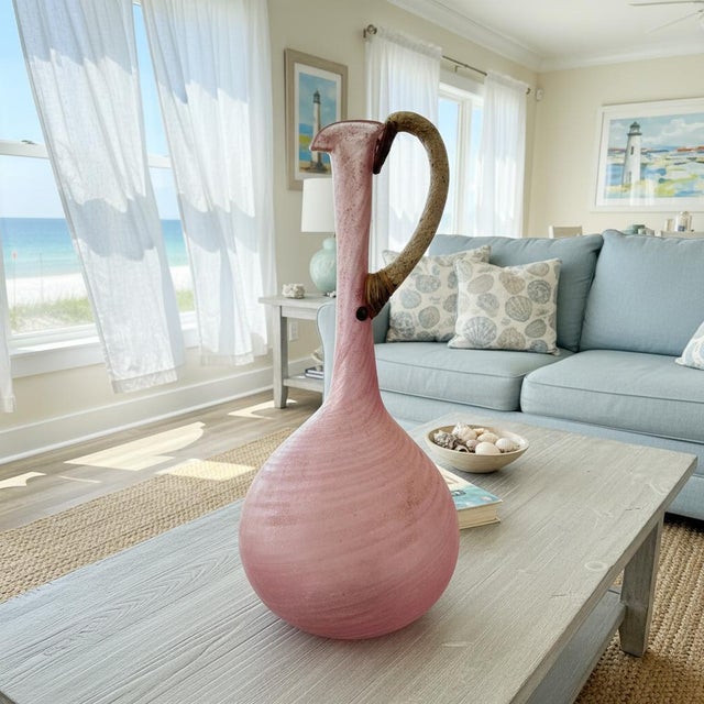 This striking large-scale blown glass ewer is the work of Billy Moon, an American studio glass artist recognized for...