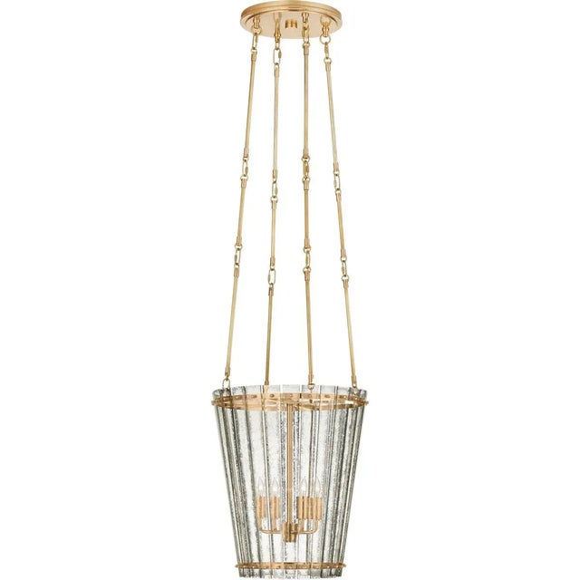 Cadence Small Tall Chandelier in Hand-Rubbed Antique Brass with Antique Mirror Designer: Carrier and Company Fixture...
