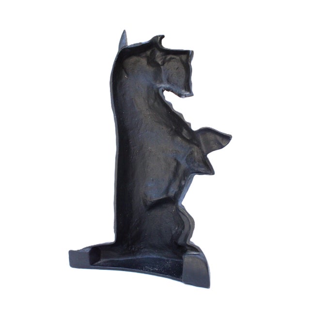 Whimsical vintage doorstop in the shape of a Scottish terrier. Made of black enameled cast iron. Perfect for an entryway...