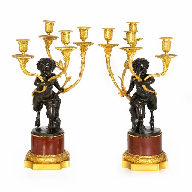 VERY FINE PAIR OF CANDELABRA WITH SATYR PUTTO EACH RAISING FOUR-LIGHTS Cast by Henry Dasson after the original models by...