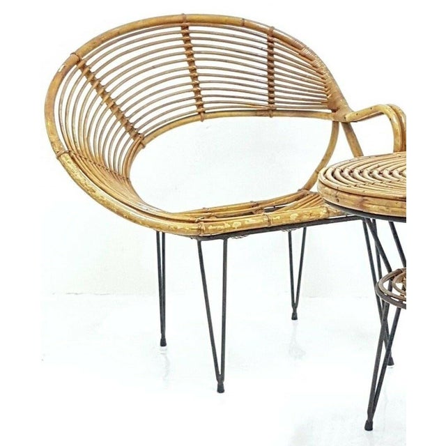 Splendid and rare original bamboo lounge set from the 1950s, consisting of two armchairs and a coffee table, designed by...