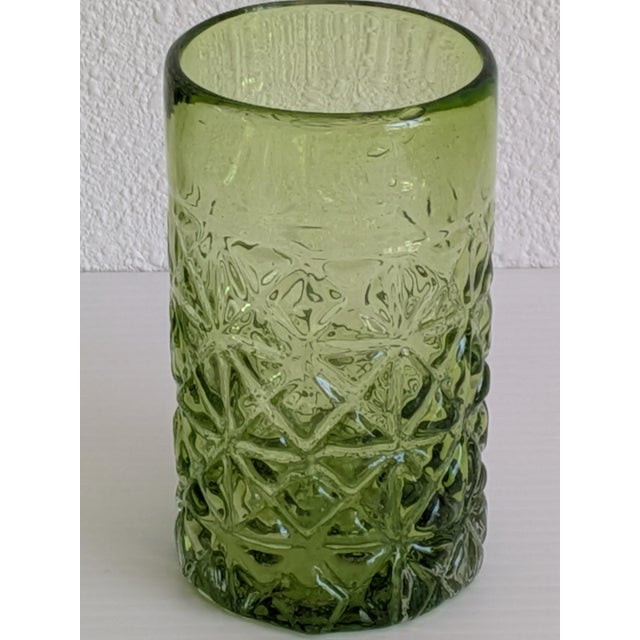Rare vintage Early 2000s set of four Mexican green drinking glasses that are hand blown into a bubble and then inserted...