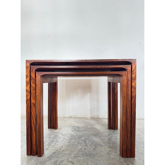 Elegant set of three nesting side tables designed by Renz in the 1960s. Each table slides neatly beneath the next,...