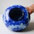 Exceptional hand painted (flow blue) style rounded porcelain vase. With an elegant vibrant cobalt blue colorway, and...