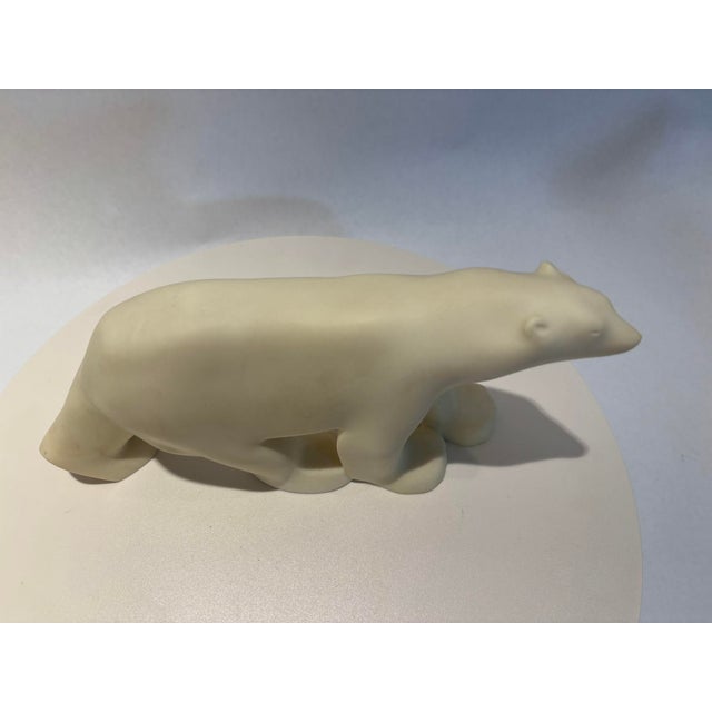 Art Deco Cast Resin White Polar Bear Sculpture after Francois Pompon. The cast resin white polar bear sculpture is a...