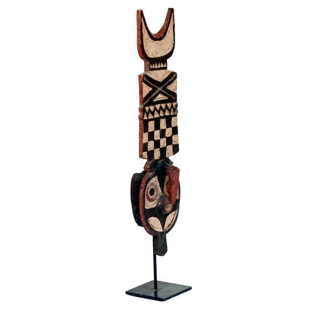Vintage African Tribal Carved Wood Totem on a metal base.. Add some interest to your bookcase or tabletop.