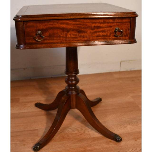 We are pleased to offer this beautiful PAIR of English Regency side tables, from the 1930s . This pair is made of Mahogany...